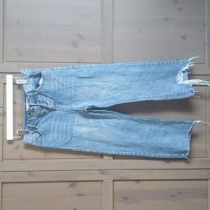 Distressed wider leg cropped-style jeans